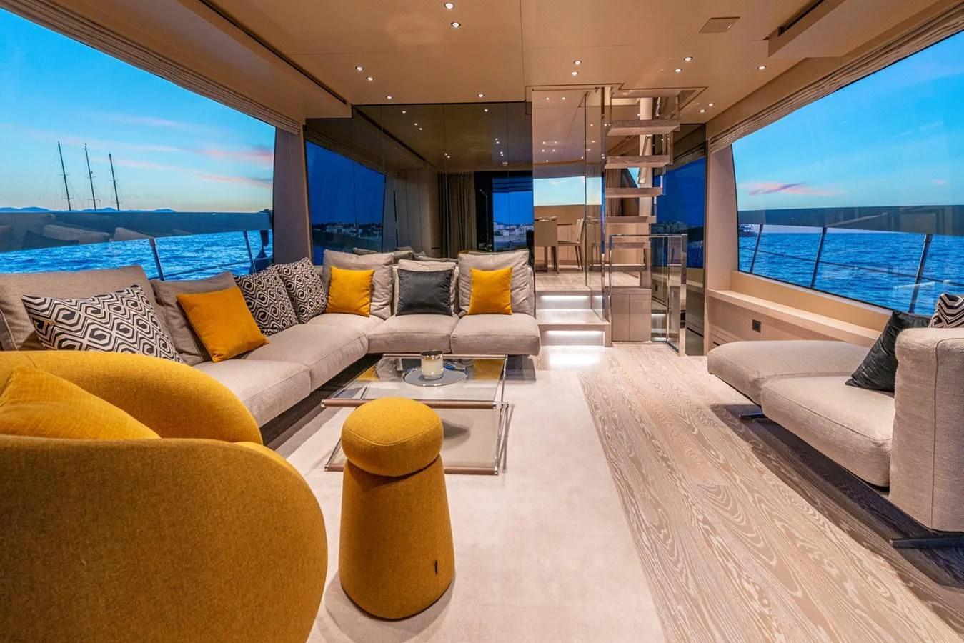 a living room with a large window aboard LOLA Yacht for Sale