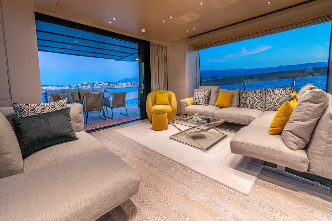 a living room with a large window aboard LOLA Yacht for Sale