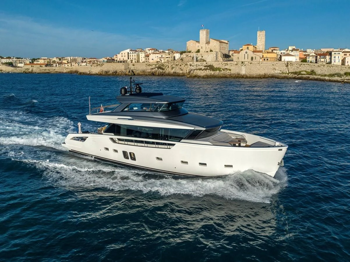 a white yacht on water aboard LOLA Yacht for Sale