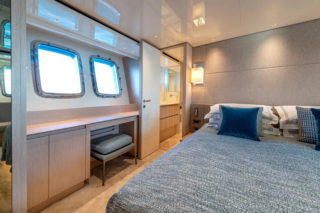 a bed in a room aboard LOLA Yacht for Sale