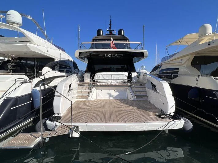 a group of boats are parked in a harbor aboard LOLA Yacht for Sale