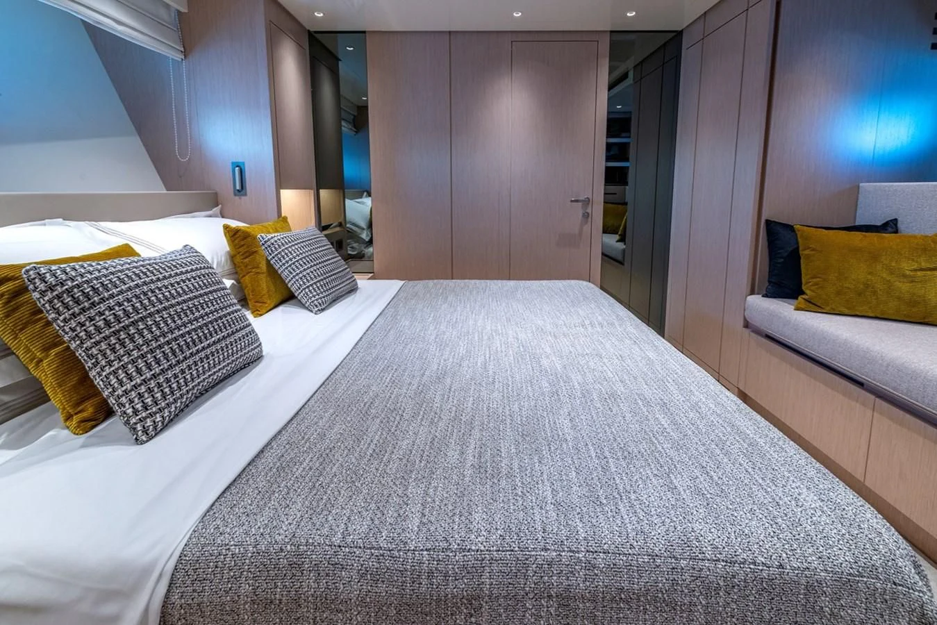 a bed with pillows aboard LOLA Yacht for Sale