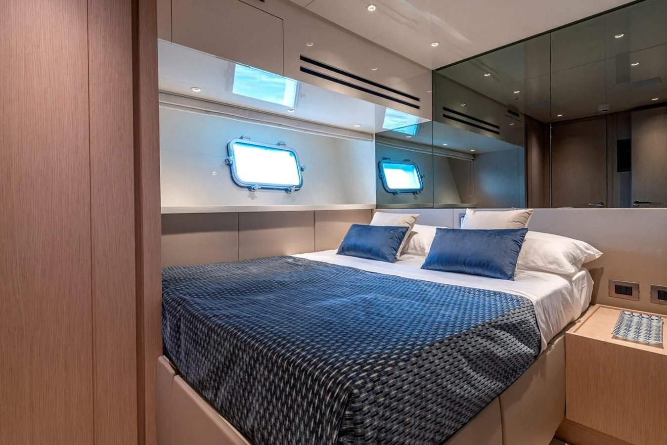 a bed in a room aboard LOLA Yacht for Sale