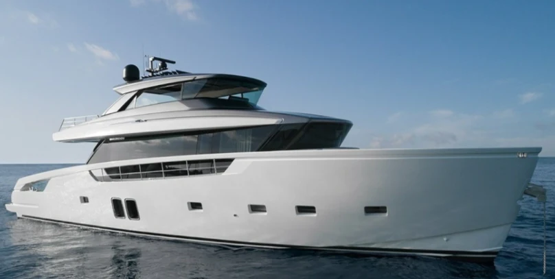 a white yacht on the water aboard LOLA Yacht for Sale