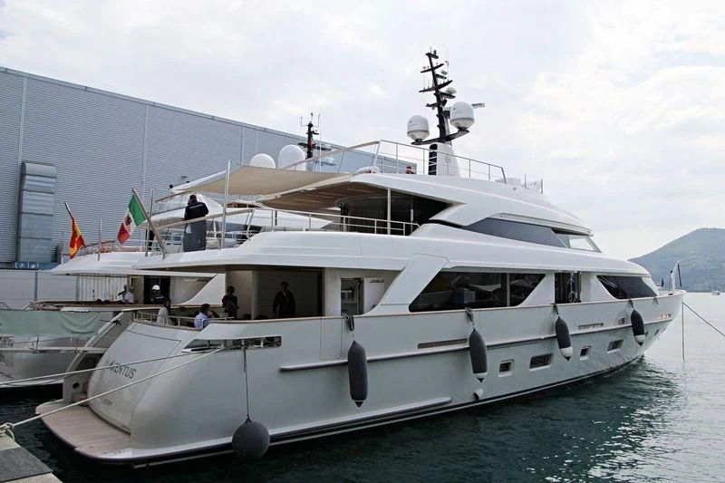 a white boat with a group of people on it aboard CHRISTINA Yacht for Sale