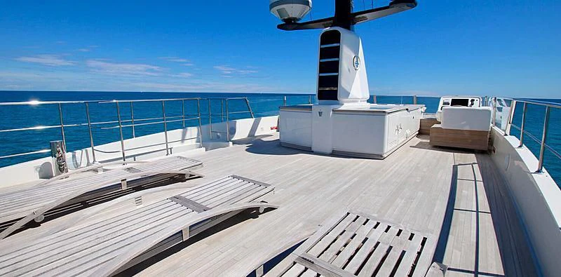 a deck with a boat on it aboard CHRISTINA Yacht for Sale