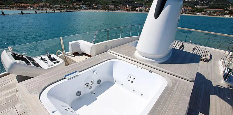 a white pool with a white cylinder on the top aboard CHRISTINA Yacht for Sale