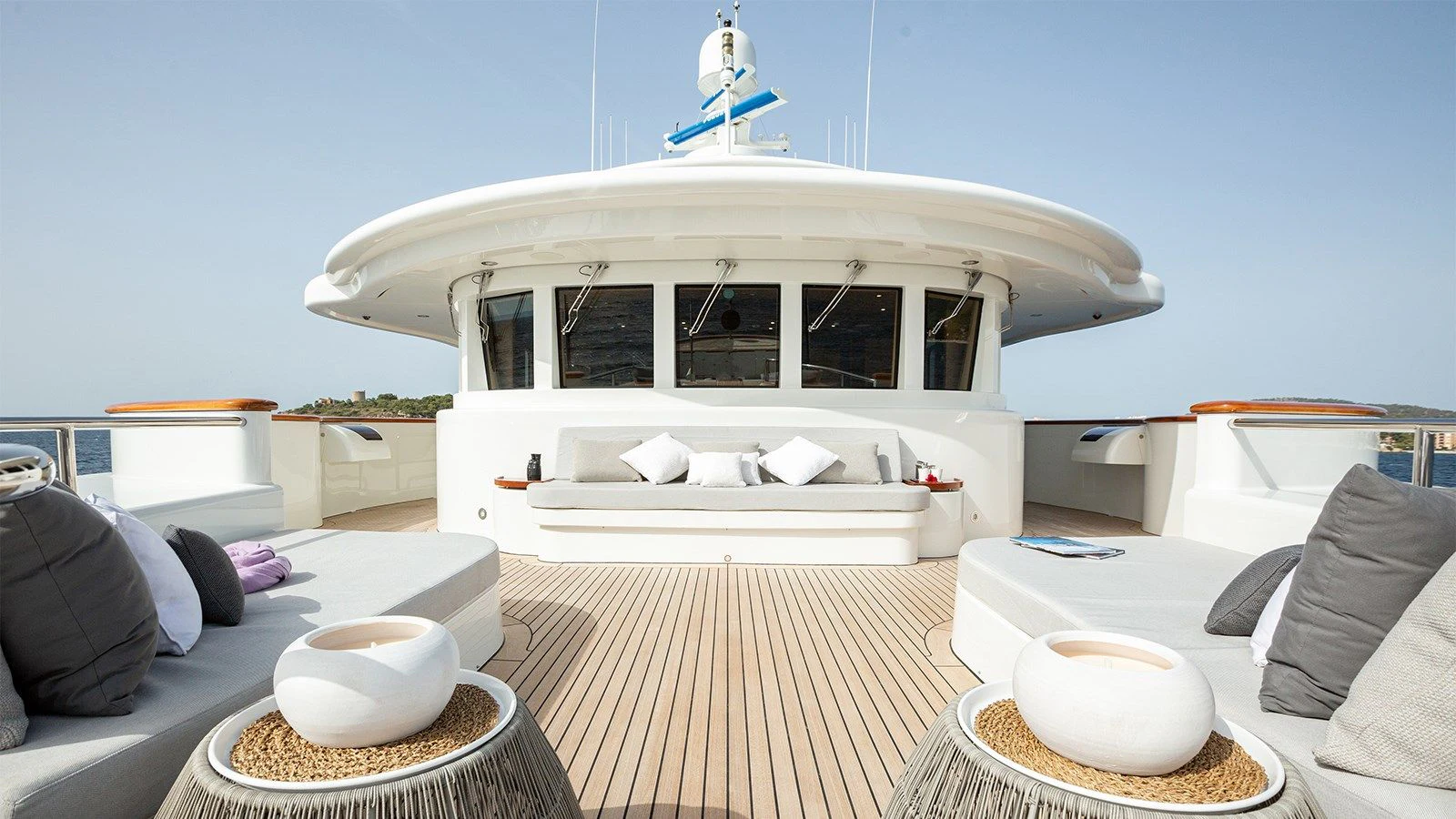 a white boat on a deck aboard INCAL Yacht for Sale
