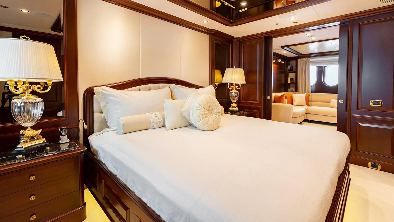 a bed with white sheets and pillows aboard INCAL Yacht for Sale