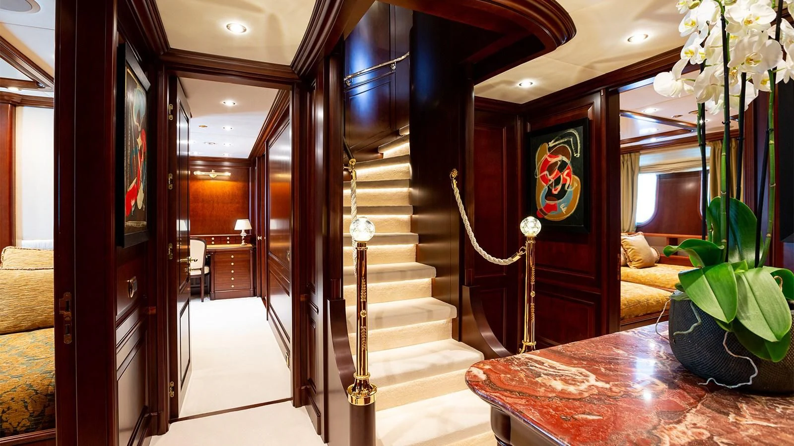 a room with a table and chairs aboard INCAL Yacht for Sale