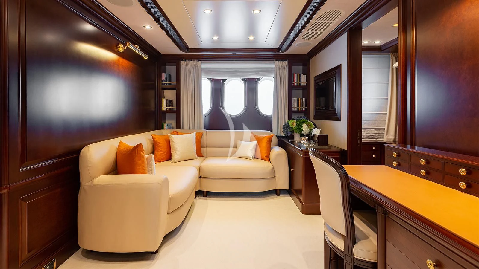 a room with a couch and a table aboard INCAL Yacht for Sale