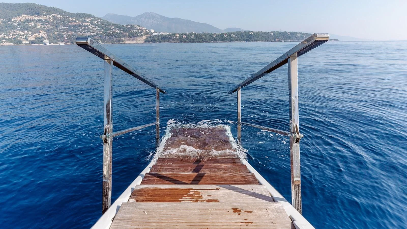 a wooden bridge over water aboard INCAL Yacht for Sale