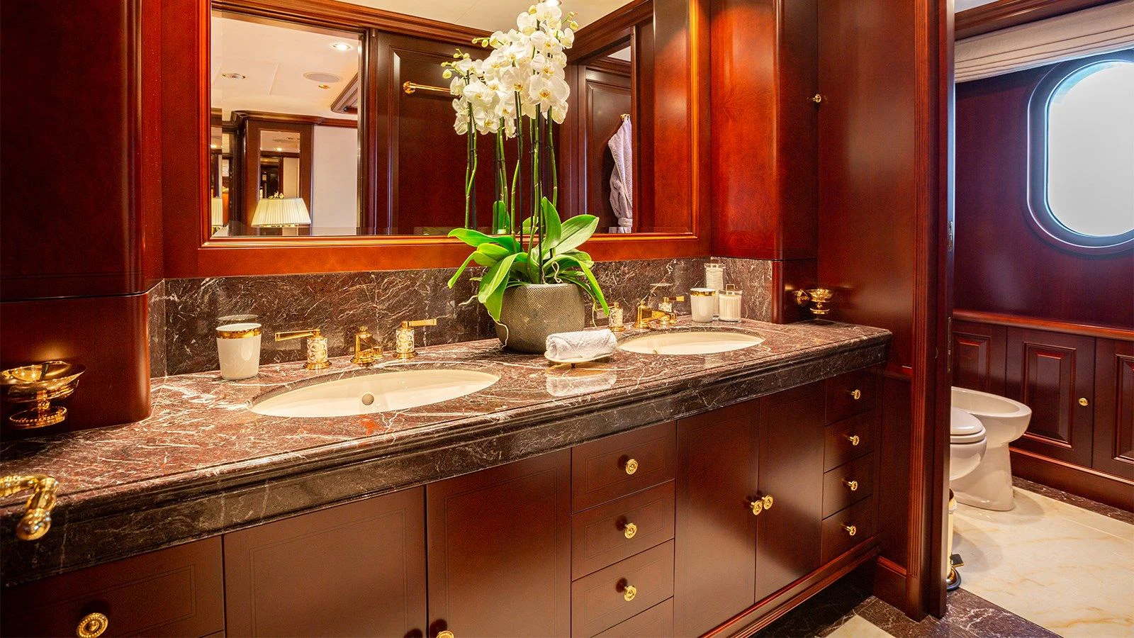 a bathroom with a countertop sink and a mirror aboard INCAL Yacht for Sale