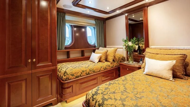 a couple of beds in a hotel room aboard INCAL Yacht for Sale