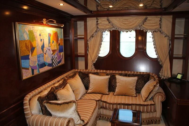a living room with a large window aboard INCAL Yacht for Sale