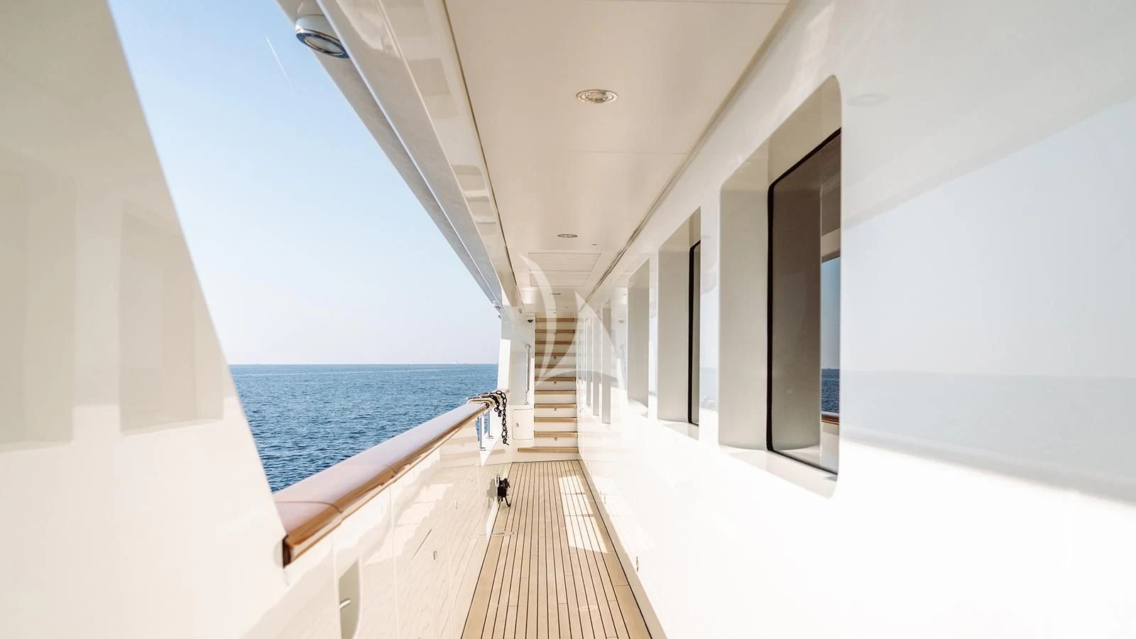 a long white hallway with white walls aboard INCAL Yacht for Sale