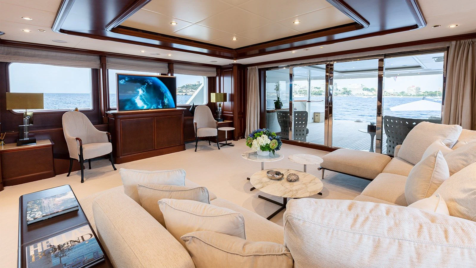 a living room with a large screen aboard INCAL Yacht for Sale
