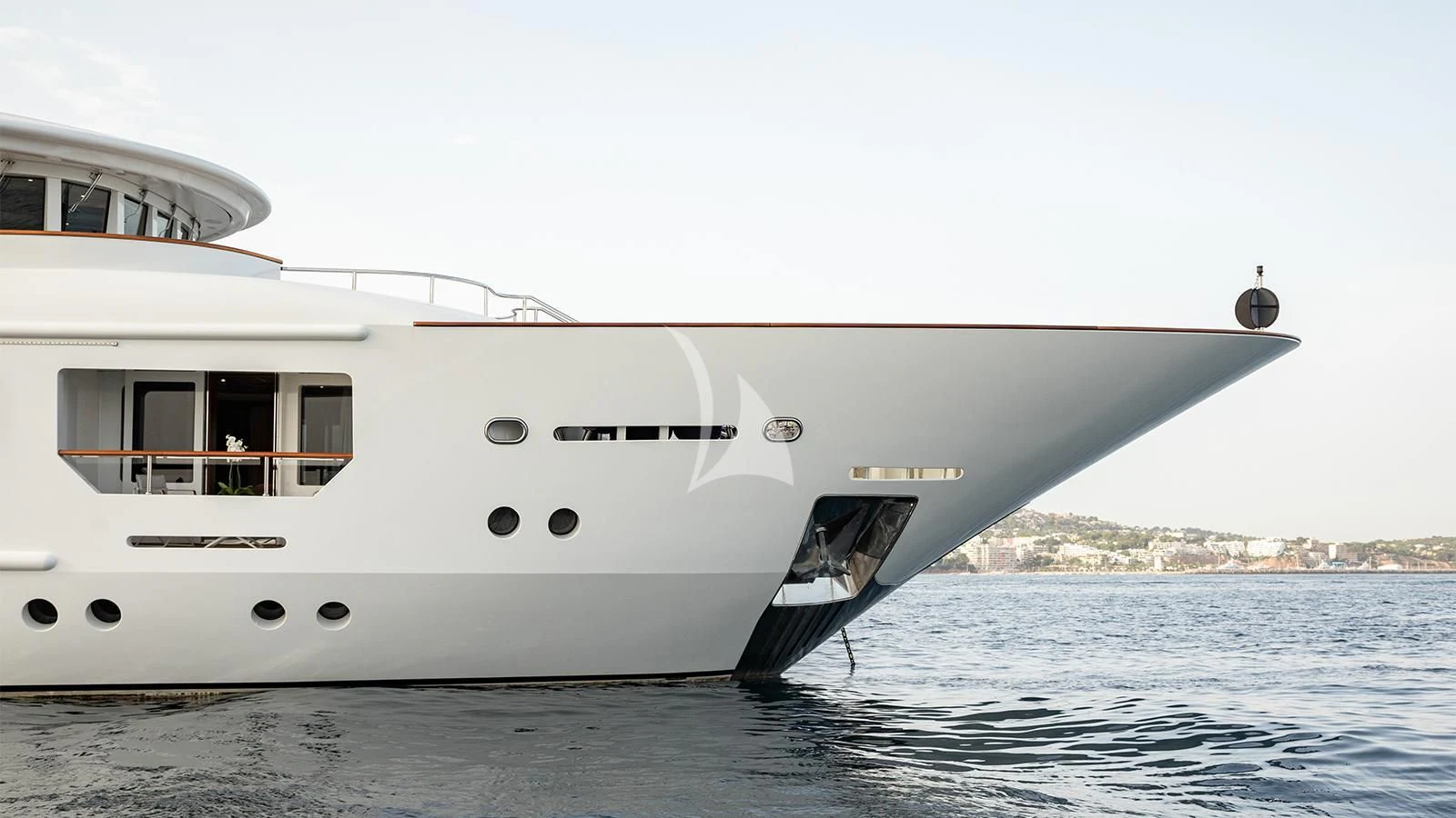 a white yacht on the water aboard INCAL Yacht for Sale