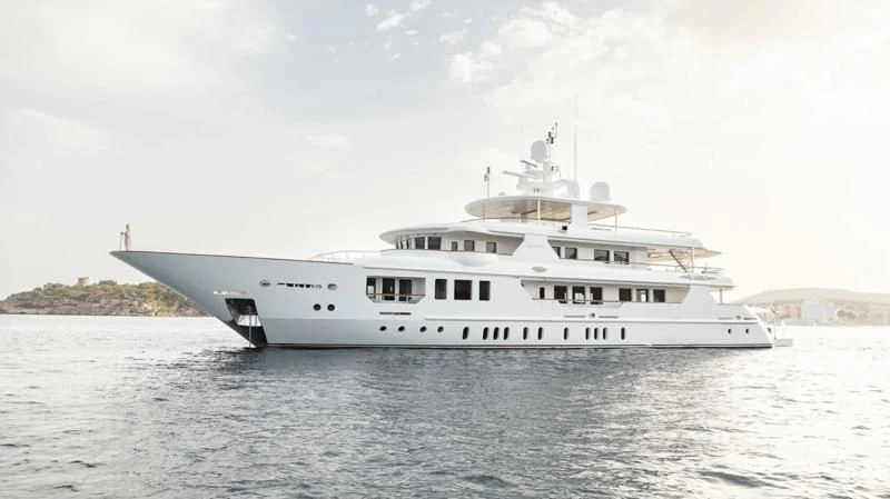 a white boat in the water aboard INCAL Yacht for Sale