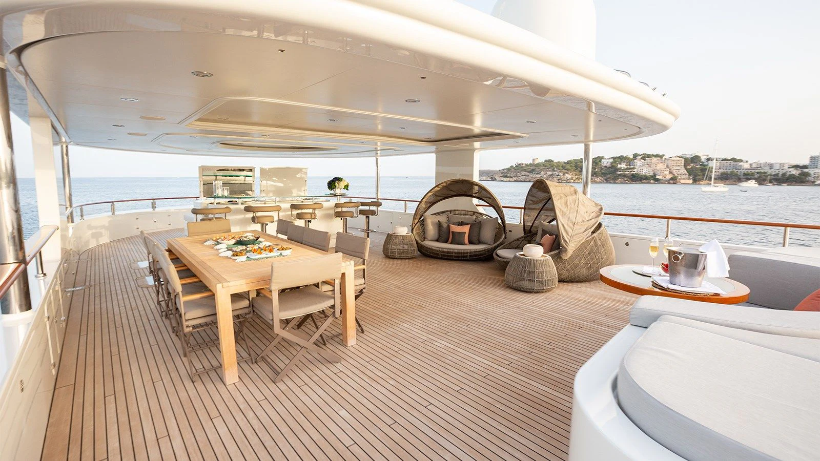 a table and chairs on a deck aboard INCAL Yacht for Sale