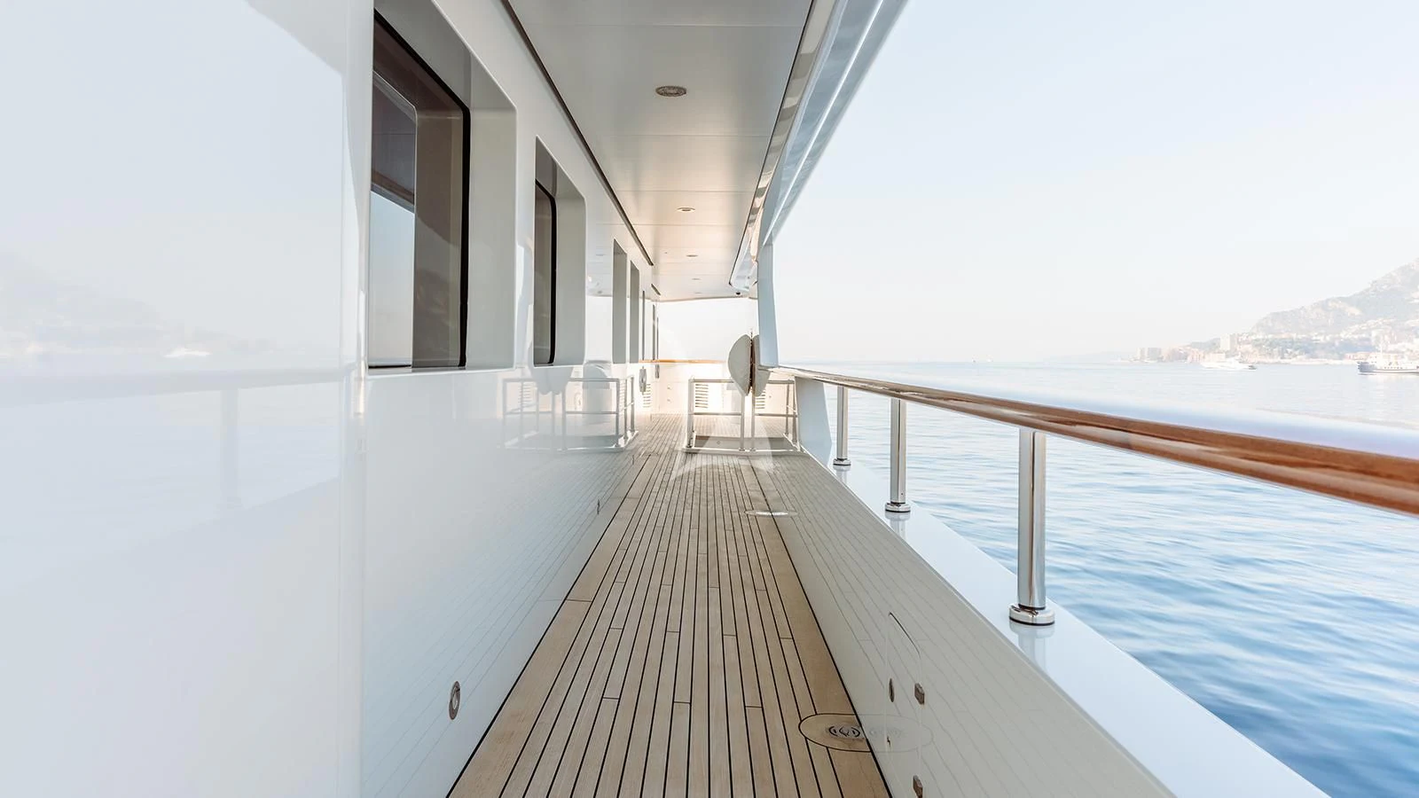a long wooden dock leading to a large body of water aboard INCAL Yacht for Sale