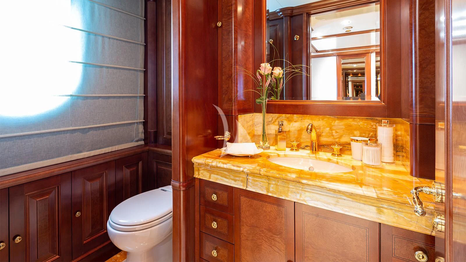 a bathroom with a sink and a toilet aboard INCAL Yacht for Sale