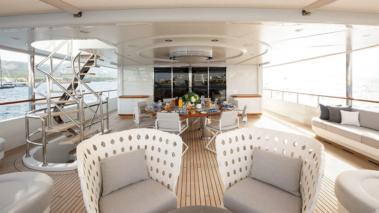 a large living room with a glass wall aboard INCAL Yacht for Sale