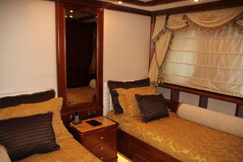 a hotel room with a bed and a desk aboard INCAL Yacht for Sale