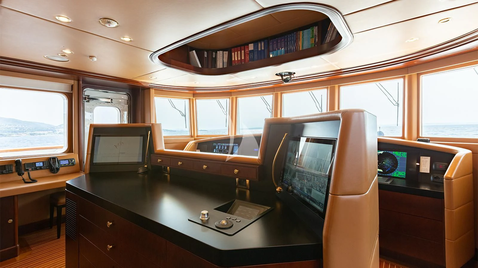 a room with computers and monitors aboard INCAL Yacht for Sale