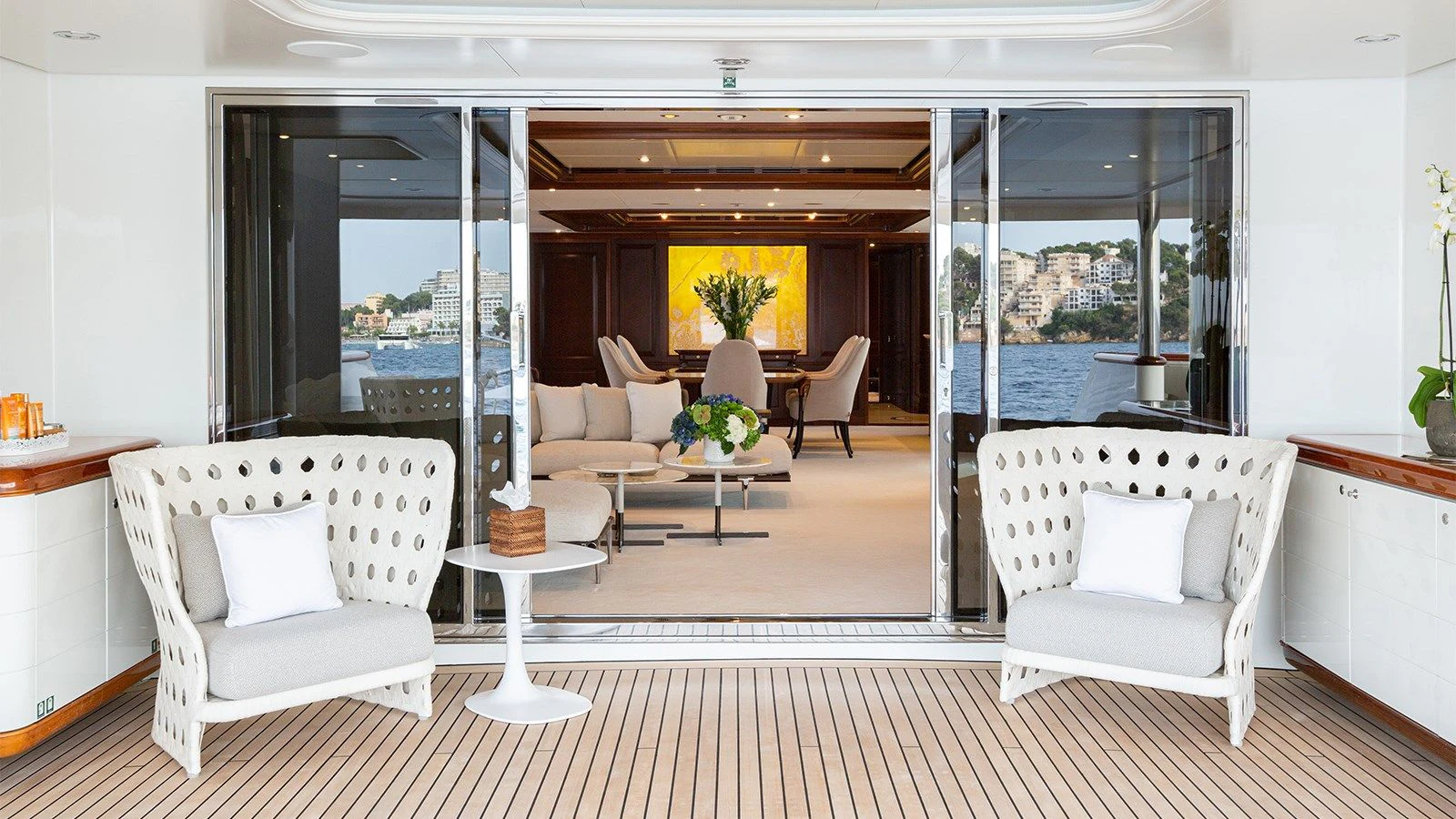 a living room with white furniture aboard INCAL Yacht for Sale