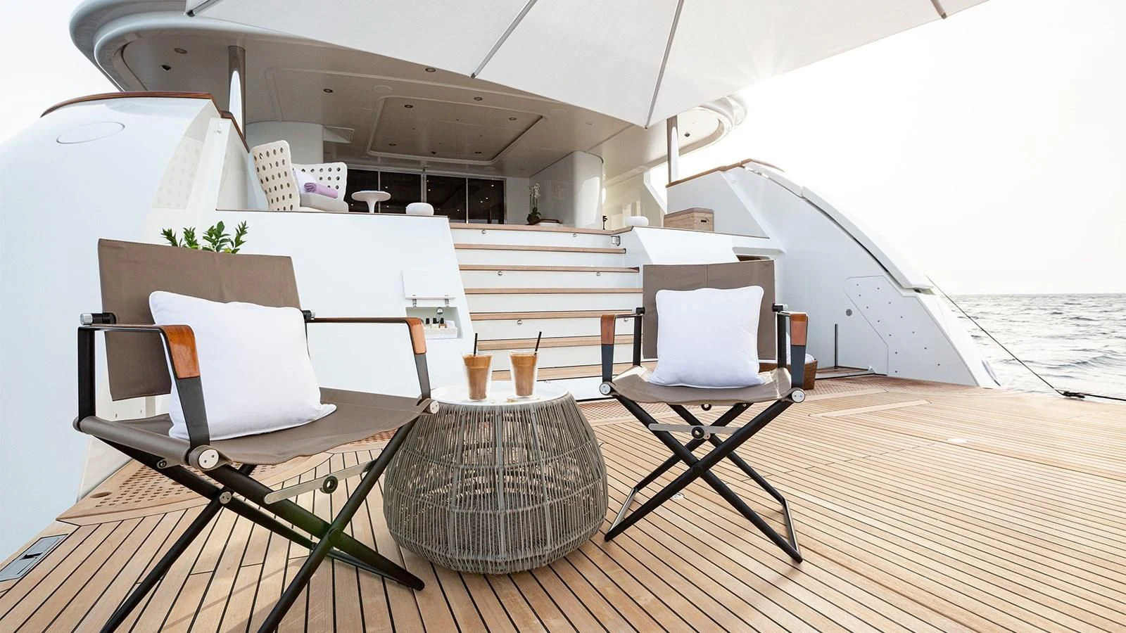 a room with a table and chairs aboard INCAL Yacht for Sale