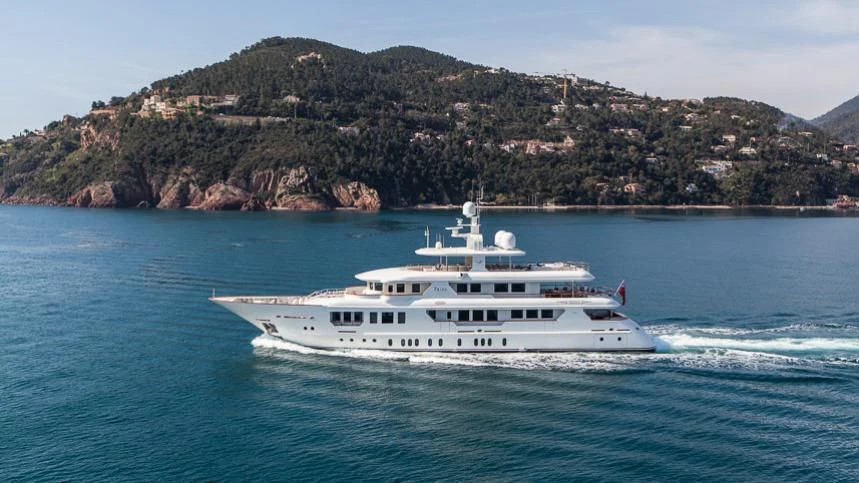 a white yacht on the water aboard INCAL Yacht for Sale