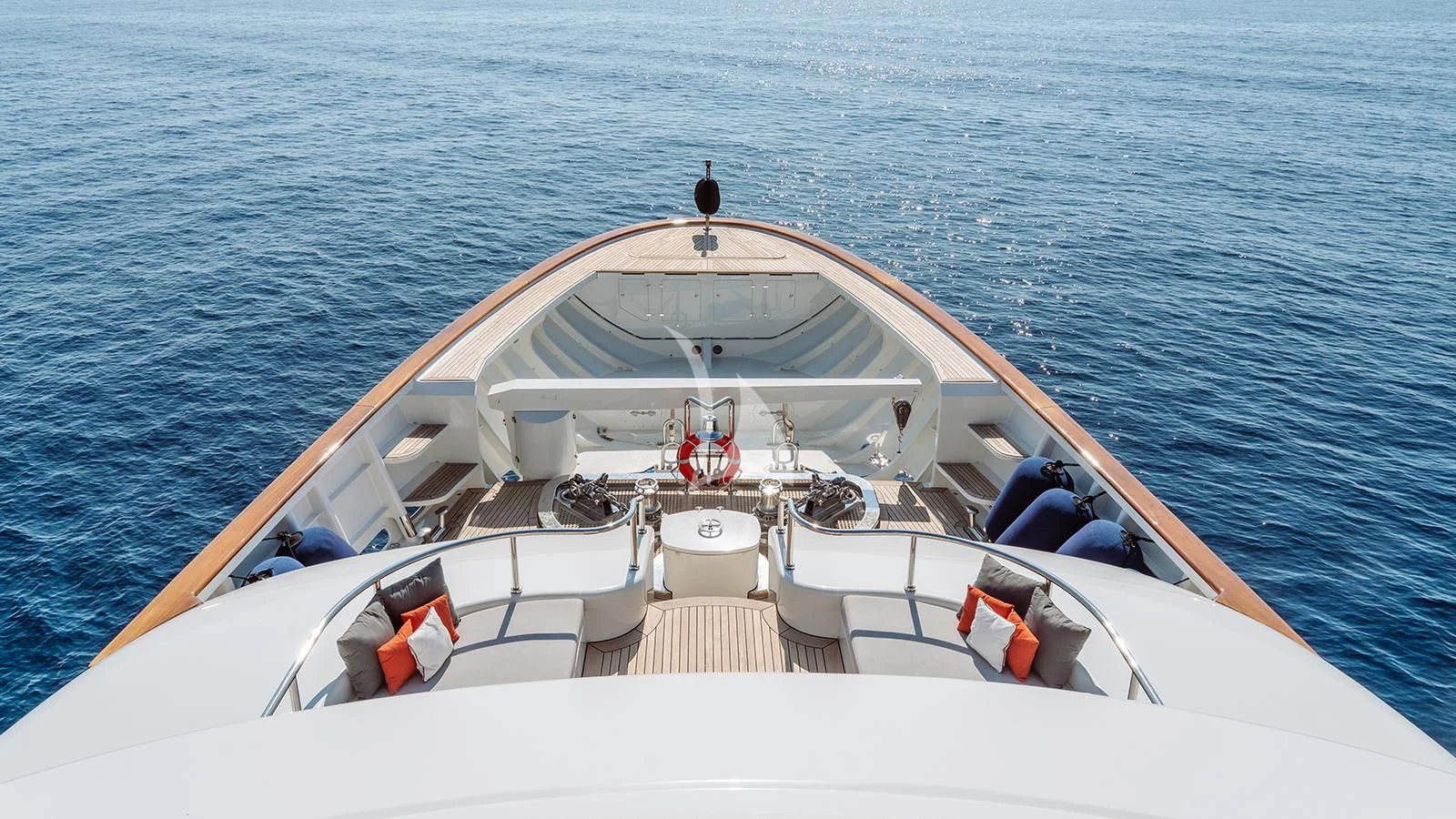a white boat on the water aboard INCAL Yacht for Sale