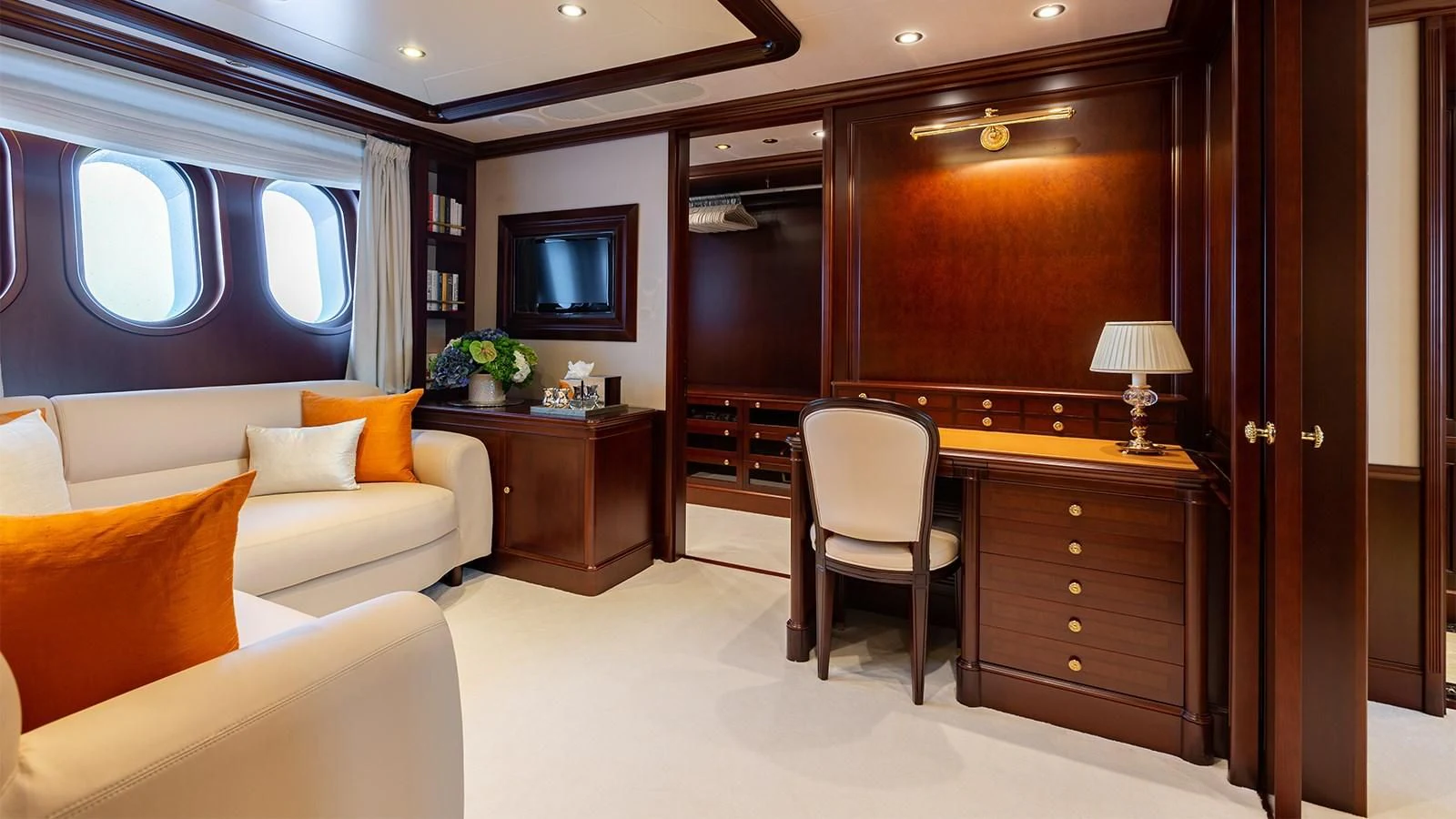a room with a couch and a television aboard INCAL Yacht for Sale