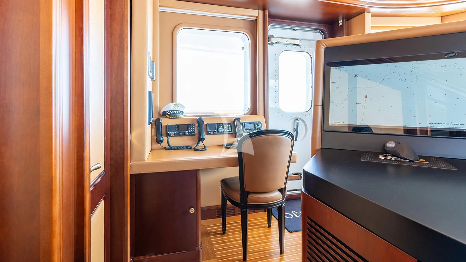 a desk with a computer and a chair aboard INCAL Yacht for Sale