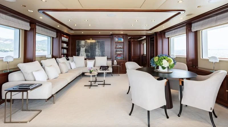 a living room with a couch and a table aboard INCAL Yacht for Sale