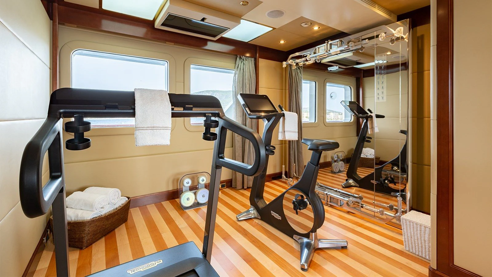 a gym with exercise equipment aboard INCAL Yacht for Sale