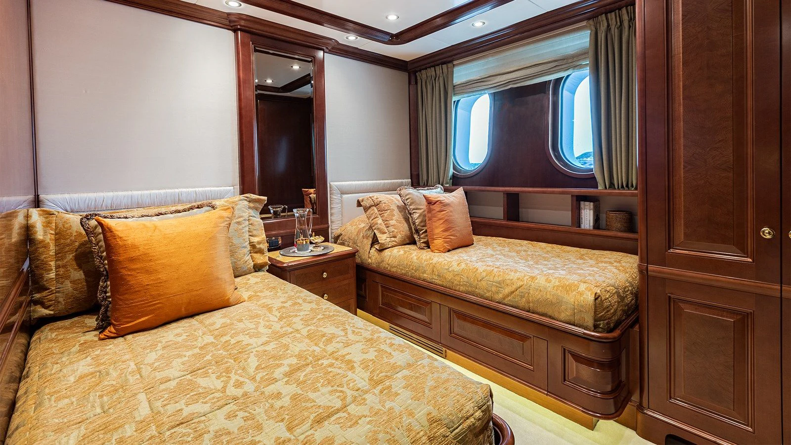 a bedroom with two beds aboard INCAL Yacht for Sale
