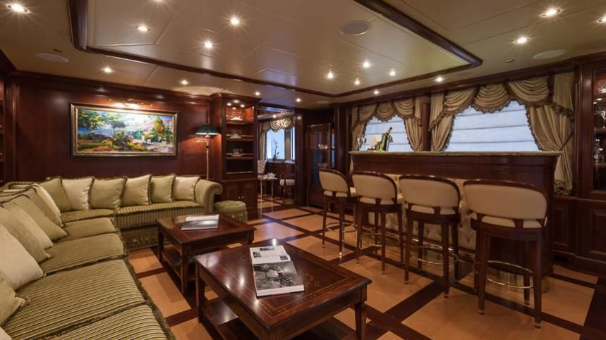 a living room with a couch and a table aboard INCAL Yacht for Sale