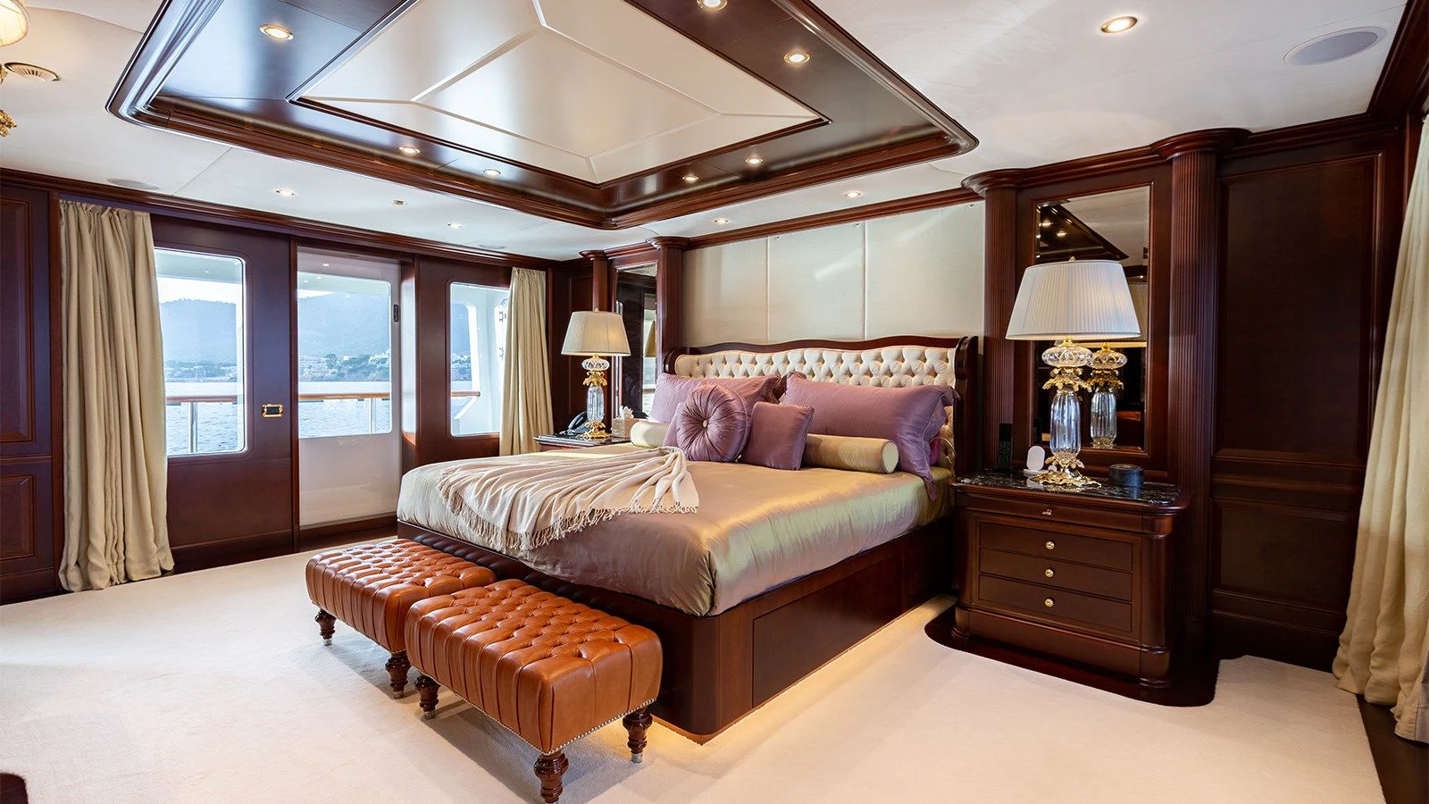 a bedroom with a bed and a desk aboard INCAL Yacht for Sale