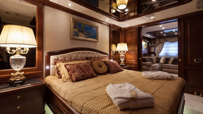 a bed with a large bed aboard INCAL Yacht for Sale