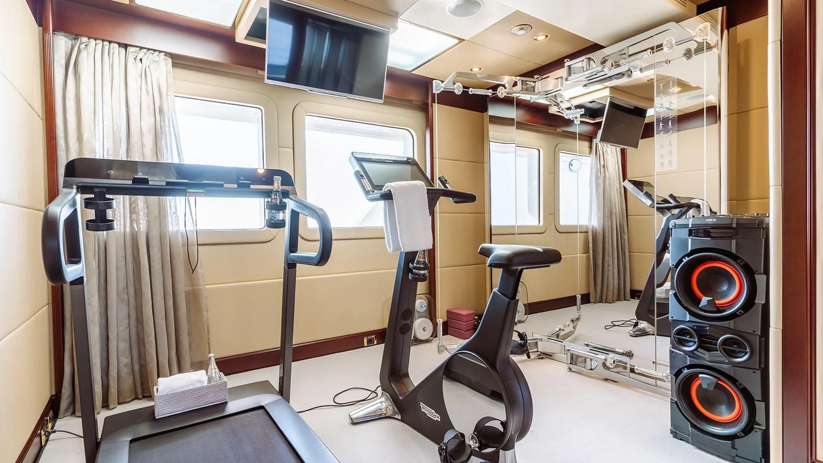 a gym with exercise equipment aboard INCAL Yacht for Sale