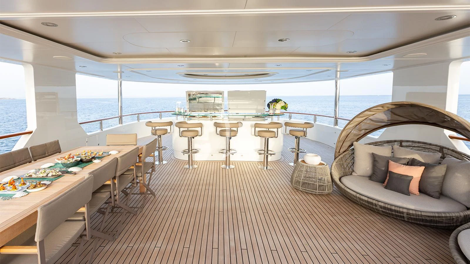 a room with a couch and a table and chairs aboard INCAL Yacht for Sale