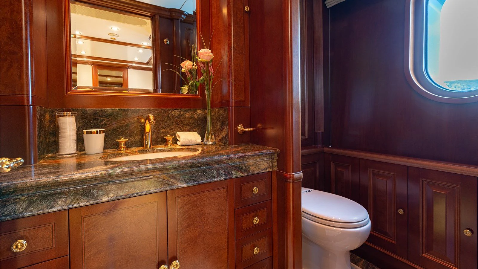 a bathroom with a countertop sink and cabinets aboard INCAL Yacht for Sale