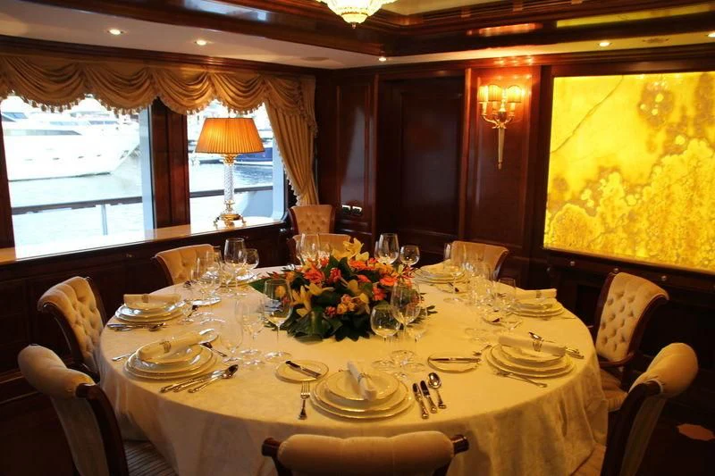 a table set for a dinner aboard INCAL Yacht for Sale
