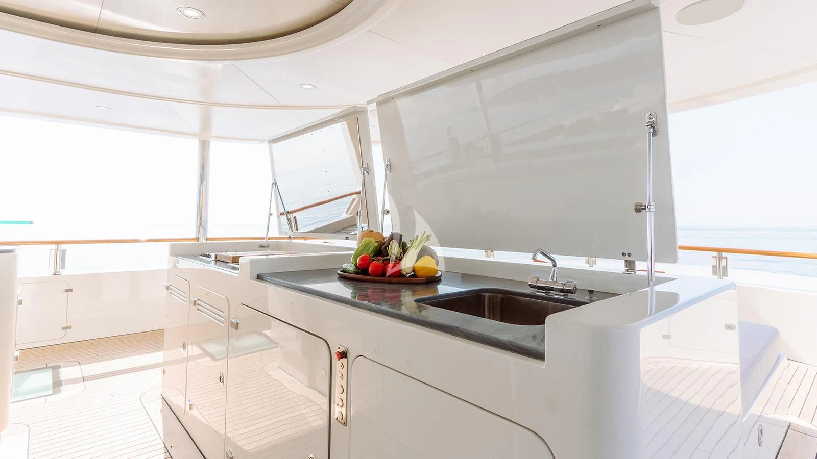 a kitchen with white cabinets aboard INCAL Yacht for Sale