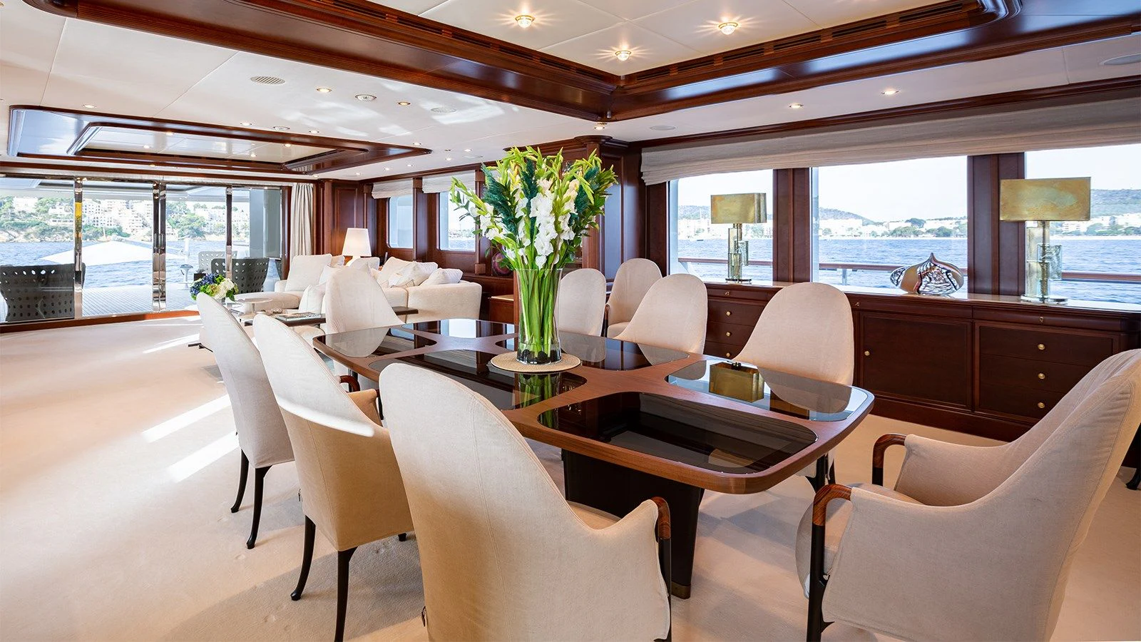 a room with tables and chairs aboard INCAL Yacht for Sale