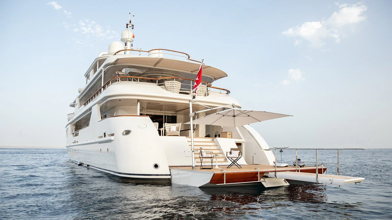 a large white boat in the water aboard INCAL Yacht for Sale
