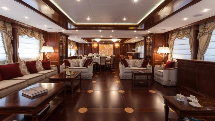 a living room with a large wood floor aboard INCAL Yacht for Sale