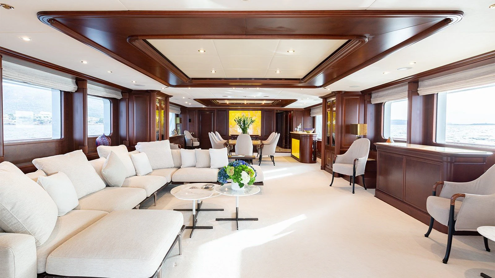 a living room with white couches aboard INCAL Yacht for Sale